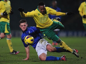 Charlee Adams of Birmingham City tackles Reece Hall-Johnson of Norwich City during the FA Youth Cup 5th round match between Norwich City U18's and Birmingham City U18's at Carrow Road on February 26, 2013