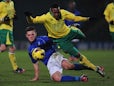 Charlee Adams of Birmingham City tackles Reece Hall-Johnson of Norwich City during the FA Youth Cup 5th round match between Norwich City U18's and Birmingham City U18's at Carrow Road on February 26, 2013