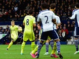 Christian Eriksen (L)of Spurs scores the opening goal with a free kick during the Barclays Premier League match against West Bromwich Albion on January 31, 2015