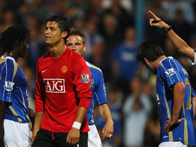 Cristiano Ronaldo of Manchester United grimaces as Referee Steve Bennett points to the sideline, after showing him the red card against Portsmouth on August 12, 2007