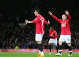 Manchester United's Portugese midfielder Cristiano Ronaldo (L) celebrates with English forward Wayne Rooney after scoring his second goal against Portsmouth on January 30, 2008