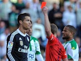 Real Madrid's Portuguese forward Cristiano Ronaldo (L) is handed a red card during the Spanish league football match Cordoba CF vs Real Madrid CF at the Nuevo Arcangel stadium on January 24, 2015