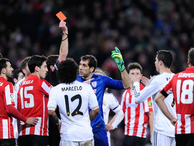 Cristiano Ronaldo (2nd R) is shown a red card during the La Liga match between Athletic Club and Real Madrid CF at San Mames Stadium on February 2, 2014