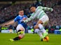 Fraser Aird of Rangers tackles Emilio Izaguirre of Celtic during the Scottish League Cup Semi-Final between Celtic and Rangers at Hampden Park on February 1, 2015 