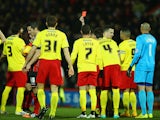 Referee Lee Probert shows Gabriele Angella of Watford (#4) a red card during the Sky Bet Championship match against Bournemouth on January 30, 2015