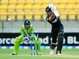 Grant Elliott of New Zealand bats while Sarfraz Ahmed of Pakistan looks on during the One Day International match on January 31, 2015