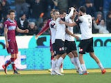 Gregore Defrel of Cesena celebrates with teammates after scoring the opening goal during the Serie A match against SS Lazio on February 1, 2015