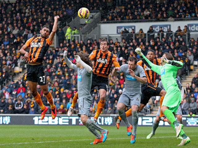 Ahmed Elmohamady of Hull City punches the ball into the Newcastle net during the Barclays Premier League match between Hull City and Newcastle United at KC Stadium on January 31, 2015