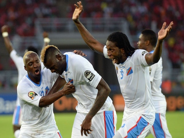 Democratic Republic of the Congo's forward Jeremy Bokila (C) is congratulated by teammates after scoring a goal during the 2015 African Cup of Nations quarter final football match against Congo on January 31, 2015