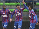 Caen's French midfielder Julien Feret (C) is congratulated by teammates after scoring a goal during the French L1 football match between Caen (SMC) and Saint-Etienne (ASSE) on February 1, 2015