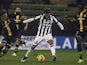 Claudio Marchisio of Juventus FC competes for the ball with Daniele Galloppa and McDonald Mariga of Parma FC during the TIM Cup match between Parma FC and Juventus FC at Stadio Ennio Tardini on January 28, 2015