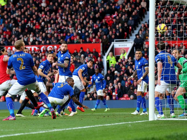 Wes Morgan #5 of Leicester City scores an own goal to give Manchester United a 3-0 first half lead during the Barclays Premier League match between Manchester United and Leicester City at Old Trafford on January 31, 2015