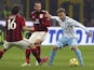 Lucas Biglia (R) of SS Lazio competes with Giampaolo Pazzini (C) of AC Milan during the TIM Cup match between AC Milan and SS Lazio at Stadio Giuseppe Meazza on January 27, 2015