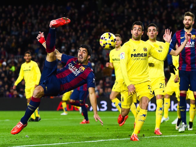 Luis Suarez of FC Barcelona performs an overhead during the La Liga match between FC Barcelona and Villarreal CF at Camp Nou on February 1, 2015