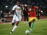 Mali's forward Modibo Maiga vies with Guinea's defender Issiaga Sylla during the 2015 African Cup of Nations group D football match between Guinea and Mali in Mongomo, on January 28, 2015