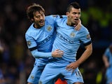 Goalscorer David Silva of Manchester City celebrates with teammate Sergio Aguero after scoring the equalising goal during the Barclays Premier League match between Chelsea and Manchester City at Stamford Bridge on January 31, 2015