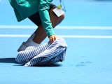 Leaks from the roof of Margaret Court Arena halt play during day eight of the 2015 Australian Open at Melbourne Park on January 26, 2015