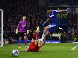Chelsea's Brazilian-born Spanish striker Diego Costa (R) comes together with Liverpool's Slovakian defender Martin Skrtel (L) during the English League Cup semi-final second leg football match on January 27, 2015