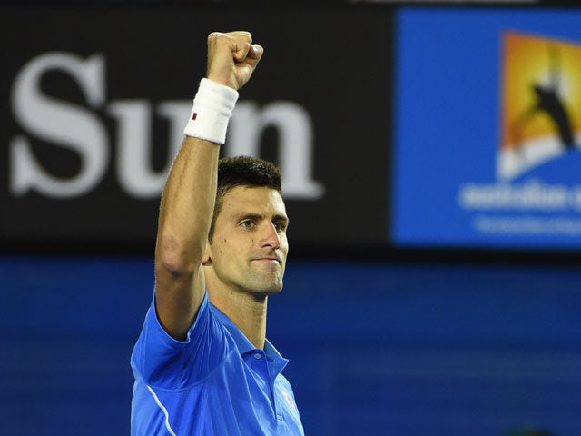 Serbia's Novak Djokovic celebrates after victory against Canada's Milos Raonic during their men's singles match on day ten of the 2015 Australian Open tennis tournament in Melbourne on January 28, 2015