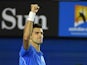 Serbia's Novak Djokovic celebrates after victory against Canada's Milos Raonic during their men's singles match on day ten of the 2015 Australian Open tennis tournament in Melbourne on January 28, 2015