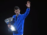 Serbia's Novak Djokovic holds the winner's trophy after defeating Britain's Andy Murray in their men's singles final match on day fourteen of the 2015 Australian Open on February 1, 2015