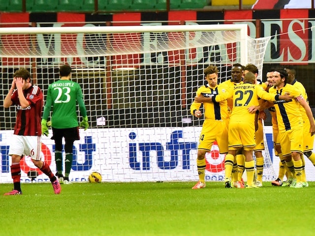 Parma's midfielder Antonio Nocerino celebrates with teammates after scoring during the Italian Serie A football match between AC Milan and Parma at San Siro Stadium in Milan on February 1, 2015