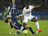 Rennes' French forward player Paul-Georges Ntep (R) vies with Paris Saint-Germain's Brazilian defender David Luiz during the French L1 football match on January 30, 2015