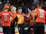 Brad Hogg of the Scorchers celebrates with team mates after taking the wicket of Jordan Silk of the Sixers during the Big Bash League final match between the Sydney Sixers and the Perth Scorchers at Manuka Oval on January 28, 2015