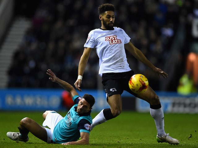 Ryan Shotton of Derby County battles with Jason Lowe of Blackburn Rovers during the Sky Bet Championship match on January 27, 2015