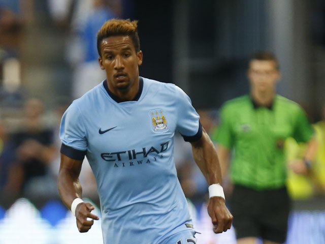 Scott Sinclair #12 of Manchester City drives past the Sporting KC defense late in the firs half on July 23, 2014