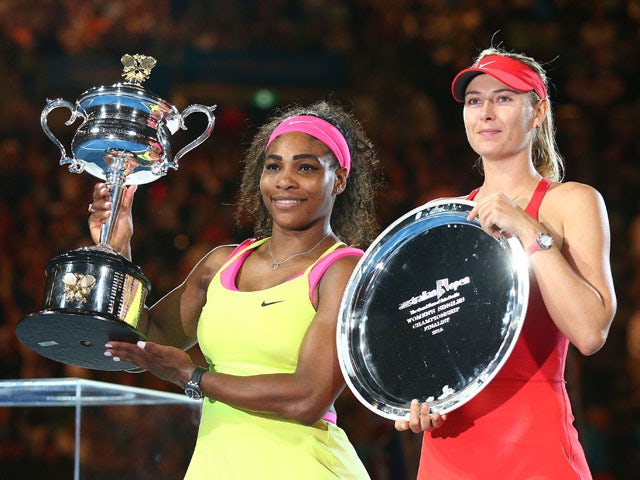  Serena Williams of the United States holds the Daphne Akhurst Memorial Cup and Maria Sharapova of Russia holds the runner up plate after their women's final match during day 13 of the 2015 Australian Open at Melbourne Park on January 31, 2015