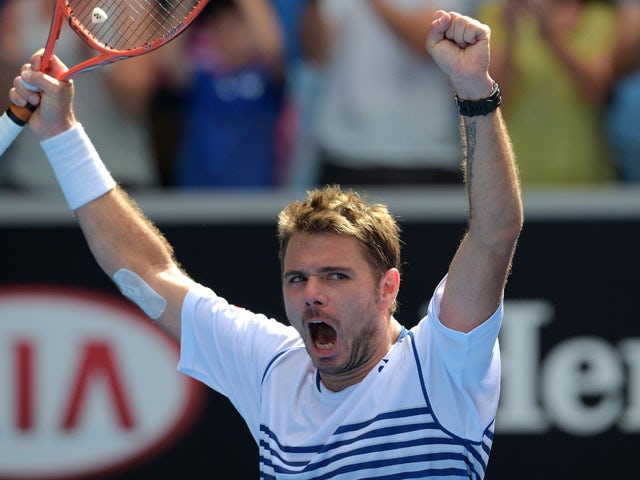 Switzerland's Stanislas Wawrinka celebrates after victory in his men's singles match against Spain's Guillermo Garcia-Lopez on day eight of the 2015 Australian Open tennis tournament in Melbourne on January 26, 2015