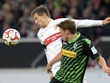 Stuttgart's defender Daniel Schwaab and Monchengladbach's forward Max Kruse vie for the ball during the German first division Bundesliga football match VfB Stuttgart vs Borussia Monchengladbach at the Mercedes-Benz Arena in Stuttgart, southern Germany, on