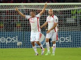 Tunisia's forward Ahmed Akaichi celebrates with Tunisia's defender Aymen Abdennour after scoring a goal during the 2015 African Cup of Nations quarter-final football match between Equatorial Guinea and Tunisia in Bata on January 31, 2015