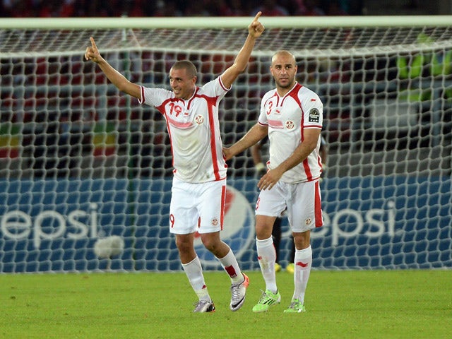 Tunisia's forward Ahmed Akaichi celebrates with Tunisia's defender Aymen Abdennour after scoring a goal during the 2015 African Cup of Nations quarter-final football match between Equatorial Guinea and Tunisia in Bata on January 31, 2015