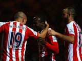 Victor Moses of Stoke City celebrates scoring their third goal with team mates during the FA Cup fourth round match against Rochdale on January 26, 2015