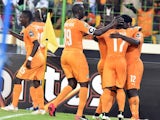 Ivory Coast's forward Wilfried Bony (R) is congratulated by teammates after scoring a goal during the 2015 African Cup of Nations quarter final football match against Algeria on February 1, 2015