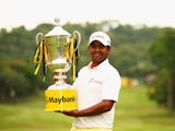 Anirban Lahiri of India poses with the trophy after victory during the final round of the Maybank Malaysian Open at Kuala Lumpur Golf & Country Club on February 8, 2015