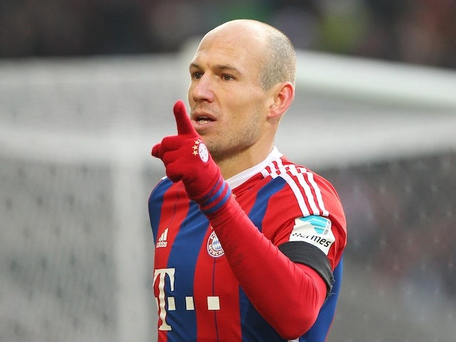 Bayern Munich's Dutch midfielder Arjen Robben celebrates scoring the first goal during the German first division Bundesliga football match against VfB Stuttgart on February 7, 2015