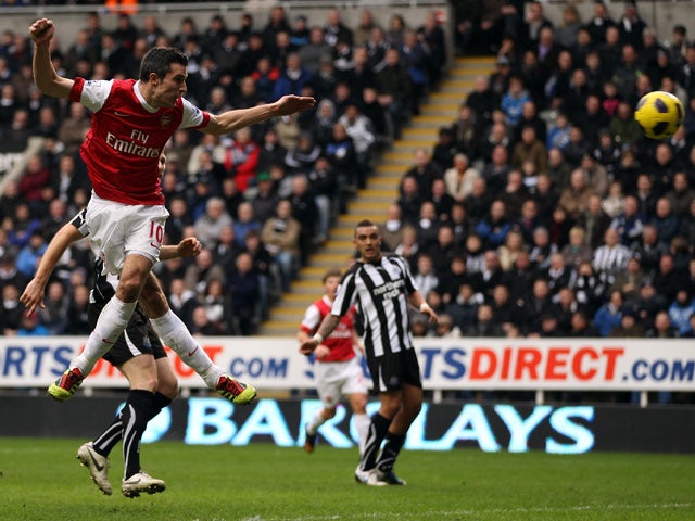 Robin Van Persie of Arsenal scores the fourth goal during the Barclays Premier League match between Newcastle United and Arsenal at St James' Park on February 5, 2011