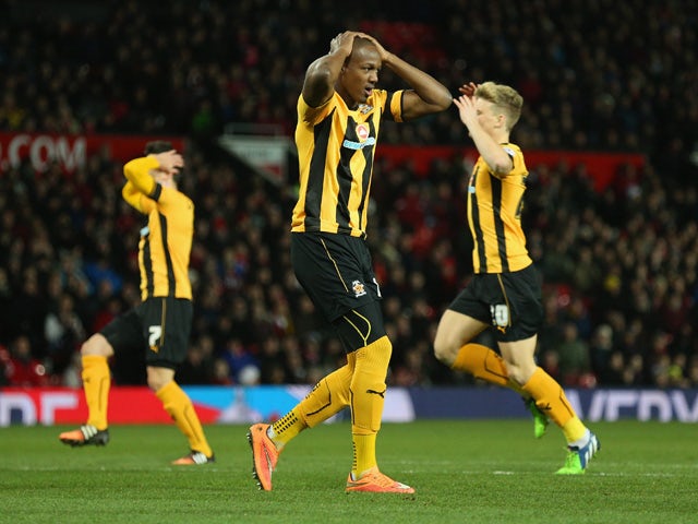 Tom Elliott of Cambridge United after hitting the post during the FA Cup Fourth round replay match between Manchester United and Cambridge United at Old Trafford on February 3, 2015 