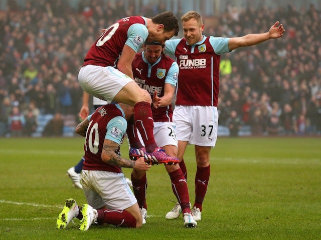 Ashley Barnes jumps on Danny Ings after scoring Burnley's first goal in the Premier League match against West Bromwich Albion at Turf Moor on February 8, 2015