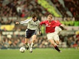 Darren Anderton of Tottenham Hotspur holds off Paul Scholes of Manchester United during the FA Carling Premiership match played at Old Trafford on December 2, 2000