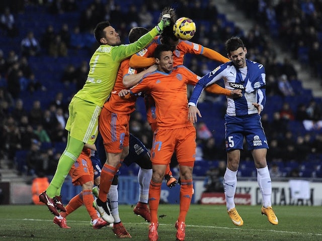 Valencia's goalkeeper Diego Alves (L) and forward Pablo Piatti (C) vie with Espanyol's defender Victor Alvarez Delgado (R) during the Spanish league football match on February 8, 2015