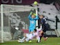 Evian's French forward Mathieu Duhamel vies with Bordeaux's French goalkeeper Cedric Carrasso during the French L1 football match Evian (ETGFC) against Bordeaux (FC) on february 7, 2015