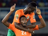 Ivory Coast's defender Serge Wilfried Kanon celebrates with defender Eric Bailly (back) after scoring his team's third goal during the 2015 African Cup of Nations semi-final football match between Democratic Republic of the Congo and Ivory Coast in Bata o