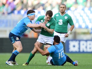 Jared Payne of Ireland is tackled by Luca Morisi (L) of Italy and Kelly Haimona (R) of Italy during the RBS Six Nations match on February 7, 2015