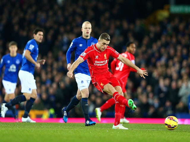 Jordan Henderson of Liverpool shoots at goal during the Barclays Premier League match between Everton and Liverpool at Goodison Park on February 7, 2015