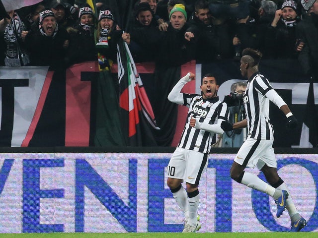 Juventus' Argentinian forward Alberto Carlos Tevez celebrates after scoring on February 7, 2015