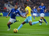 Danny Simpson of Leicester City closes down Wilfried Zaha of Crystal Palace during the Barclays Premier League match between Leicester City and Crystal Palace at the King Power Stadium on February 7, 2015